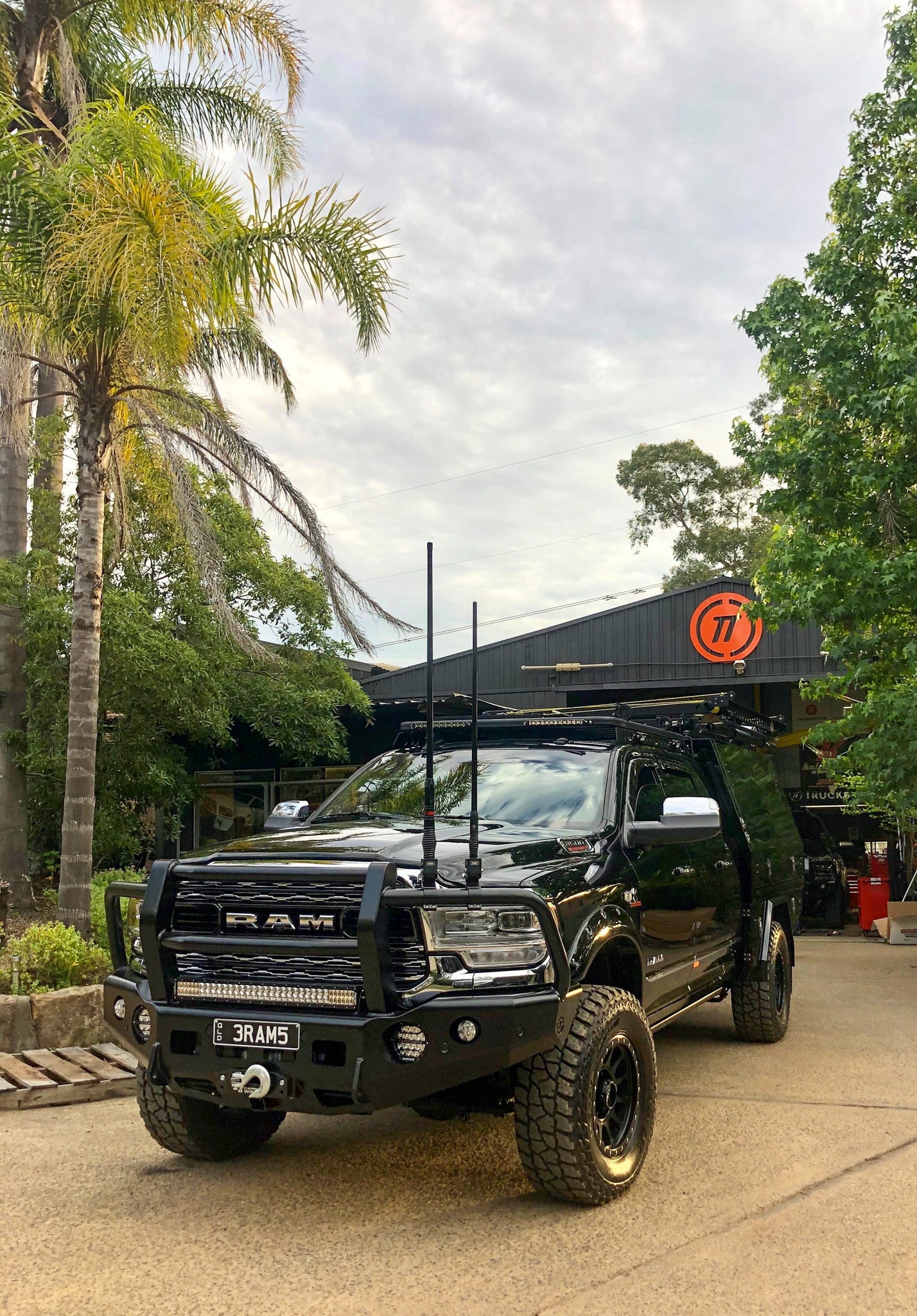 TrailReady DJII 2500/3500 full guard bullbar by Trucks N Toys mounted on a pickup truck, showcasing sturdy metal construction.