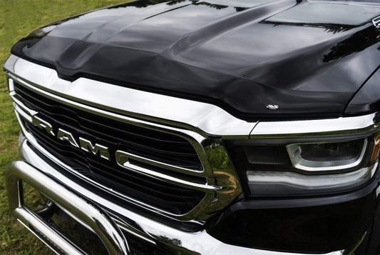 LUND Motion Products Inc AVS Aeroskin Smoke Bonnet Protect AXS on vehicle hood, designed for aerodynamic bonnet protection.