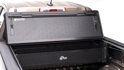 Black BAKFlip G2 tonneau cover installed on RAM 1500, 2500, and 3500 trucks, showing its sleek, foldable design for bed protection.
