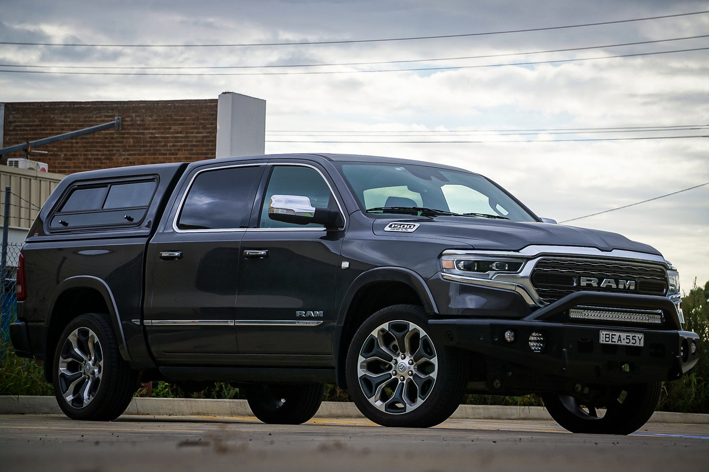 TrailReady 2019+ DT 1500 Pre Runner truck wheels and tires mounted on a vehicle, showcasing off-road performance and rugged design.