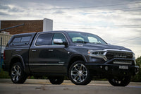 TrailReady 2019+ DT 1500 Pre Runner truck wheels and tires mounted on a vehicle, showcasing off-road performance and rugged design.
