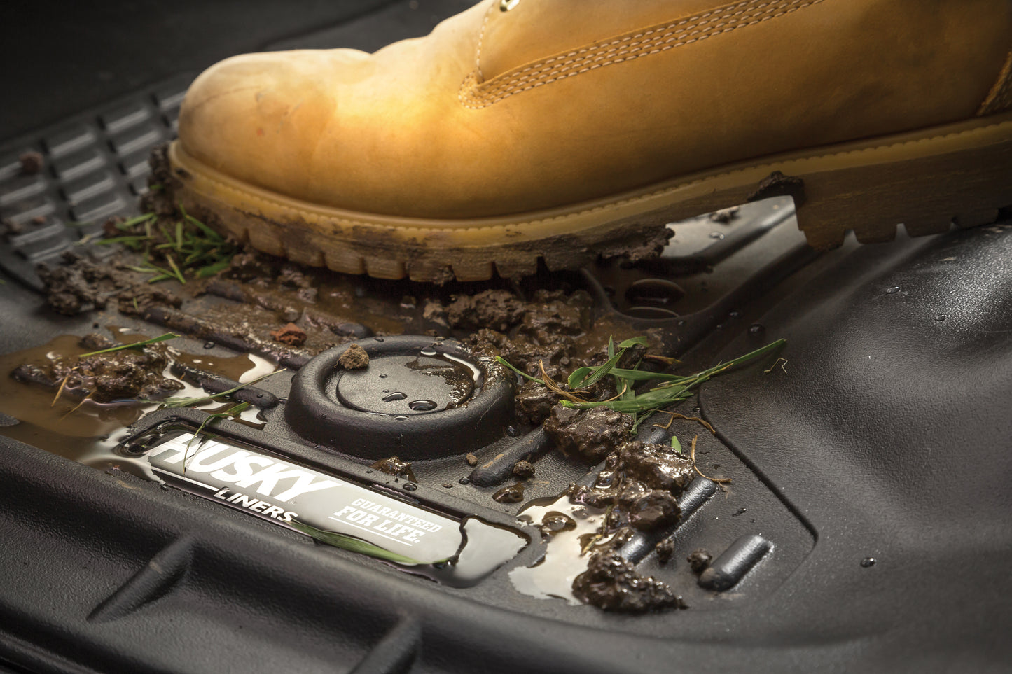 Muddy Husky Liners X-ACT AXS floor liners for Dodge Ram 1500 Quad Cab, showing durable all-weather protection and rugged design.