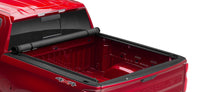 LUND Motion Products Inc Roll Up SOFT Tonneau cover on Ram 1500 Express, 2500, and 3500 trucks, shown rolled up on the truck bed.
