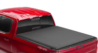 LUND Motion Products Ram 1500 Express, 2500, 3500 soft roll-up tonneau cover installed on pickup truck bed.
