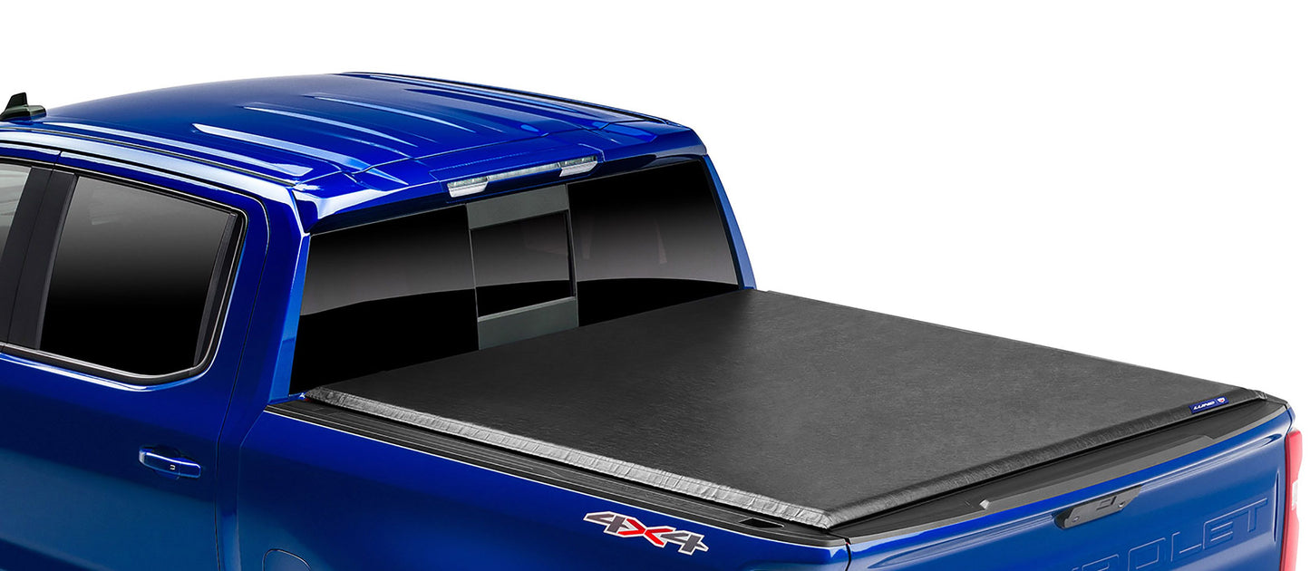 LUND Motion Products Inc Roll Up SOFT Tonneau cover on a Ram 1500 Laramie truck, shown rolled up for easy bed access.