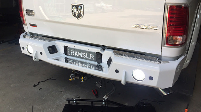 TrailReady rear bumper for RAM 2500 and 3500 trucks, rugged steel construction with mounting points for accessories.