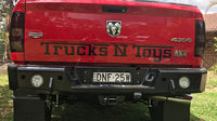 TrailReady rear bumper for RAM 2500 and 3500 trucks, featuring a rugged steel design with mounting points and a textured finish.