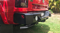 TrailReady rear bumper for RAM 2500 and 3500 trucks, featuring durable steel construction and mounting hardware.