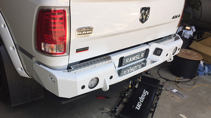 TrailReady rear bumper for RAM 2500 and 3500 trucks, rugged steel construction, mounted on a pickup truck.