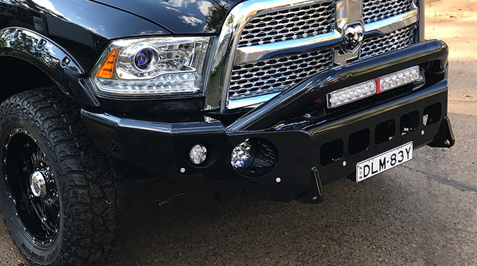 TrailReady Pre-Runner Bar by Geared for Adventure installed on RAM 2500 and 3500 trucks, showing rugged off-road design.