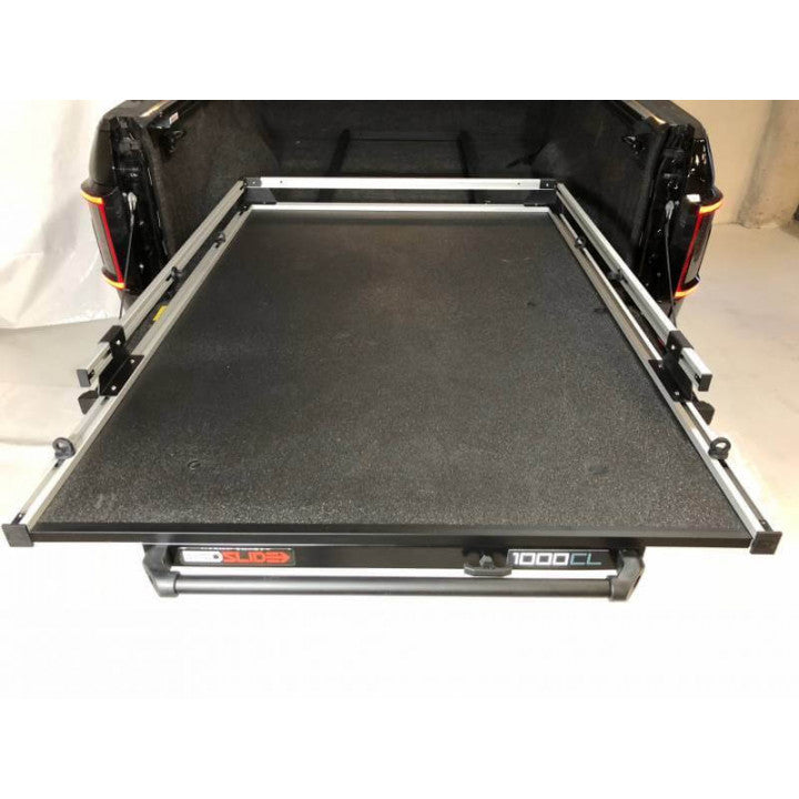 BedSlide Classic Silver bed slide installed in Ram 1500/2500 with 5'7" Rambox, showing the durable slide mechanism and sleek finish.