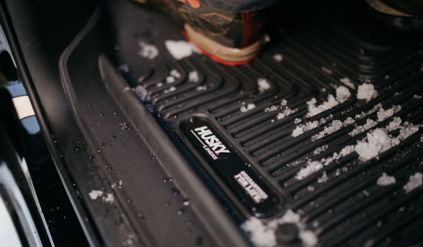 HUSKY LINERS X-ACT AXS for Dodge Ram 3500 Crew Cab, durable all-weather floor liners with textured surface and raised edges.